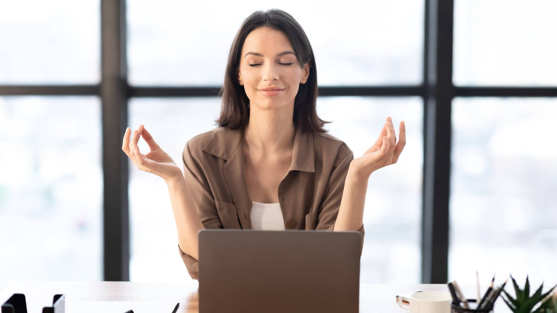 Woman meditating with ViSound Drift invisible earbuds for better focus and calm