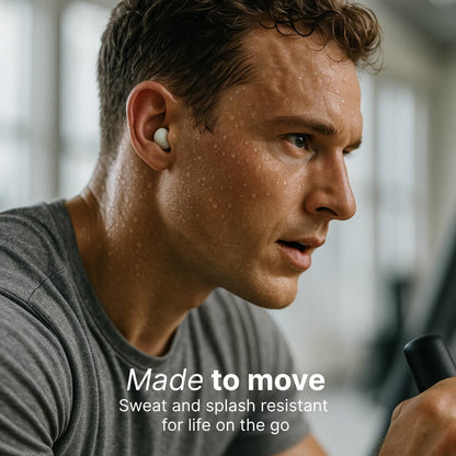 Photograph of an intense, sweating man wearing a white wireless earbud and a grey t-shirt exercising in a gym, with the overlay text Made to move Sweat and splash resistant for life on the go