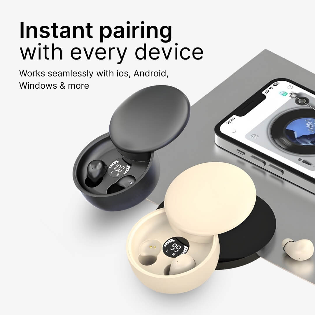 Product photograph of two open wireless earbud charging cases, one black showing 100% charge and one beige showing 99%, displayed alongside a smartphone with a record player music app and prominent text "Instant pairing with every device"