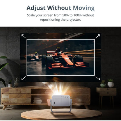 A white portable projector with a gray stand on a wooden coffee table in a contemporary living room projects an adjustable screen of a red Formula 1 race car racing on a dark track, featuring text "Adjust Without Moving" and "Scale your screen from 50% to 100% without repositioning the projector"