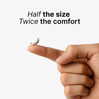 Digital product photo of a tiny white bean-shaped wireless earbud resting on a human index finger against a light background, with overlay text Half the size Twice the comfort