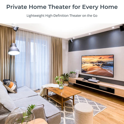 A modern home theater living room featuring a large television displaying a vibrant beach sunset, sleek ceiling-mounted speakers, a comfortable gray sectional sofa, and a light wood media console