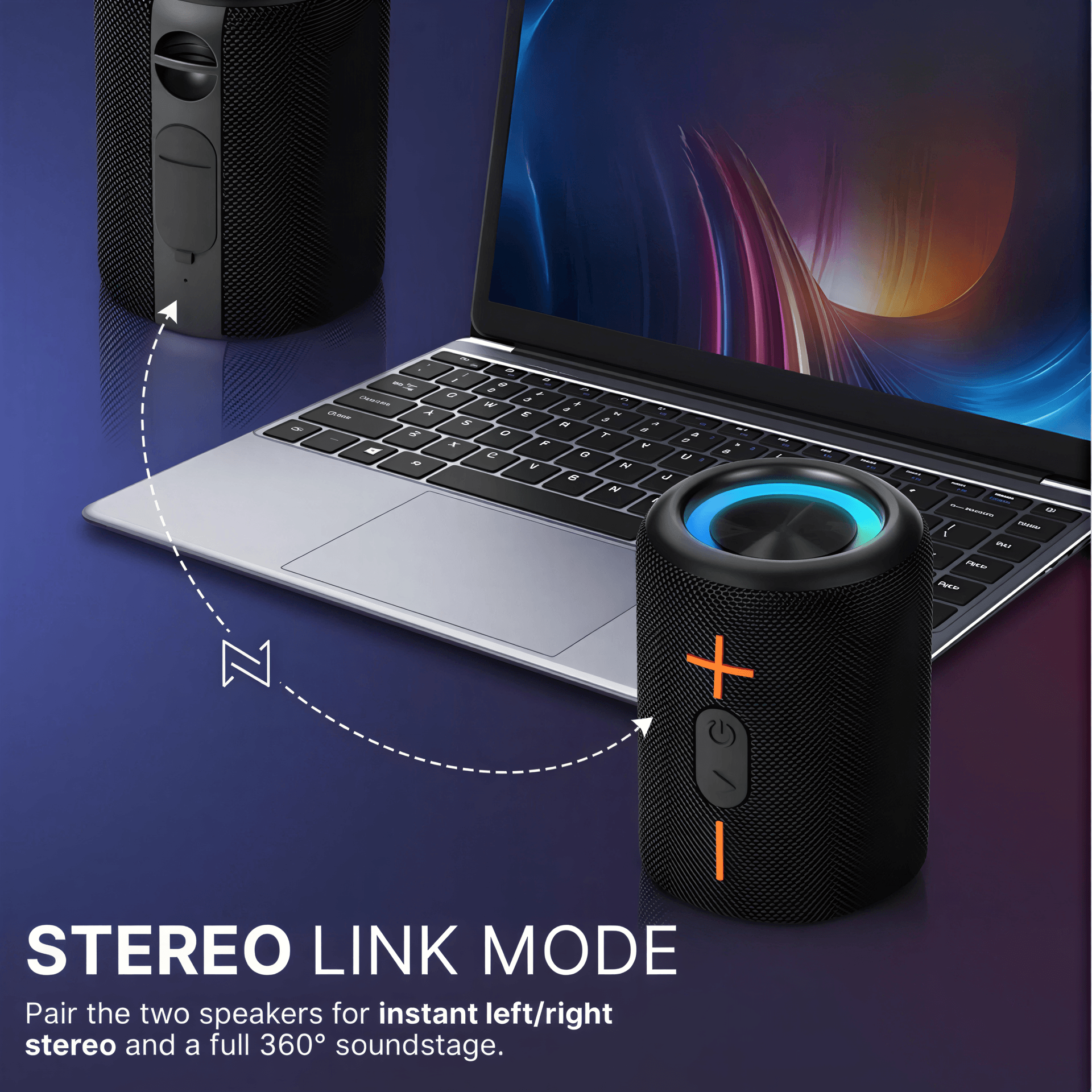 Product image showcasing two black wireless speakers in Stereo Link Mode, one with a blue glowing top and orange power/volume buttons, linked by a dashed line to a second speaker, positioned in front of a silver laptop with a colorful abstract screen on a dark blue surface