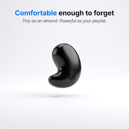 Product photograph of a single small glossy black wireless earbud with a circular control button floating above a clean white studio background featuring overlay text Comfortable enough to forget Tiny as an almond Powerful as your playlist
