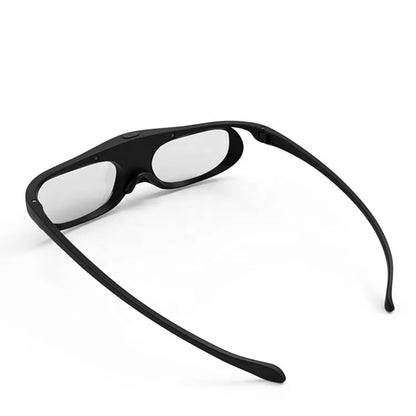 Digital photograph of sleek black active 3D glasses with clear reflective lenses against a clean white background