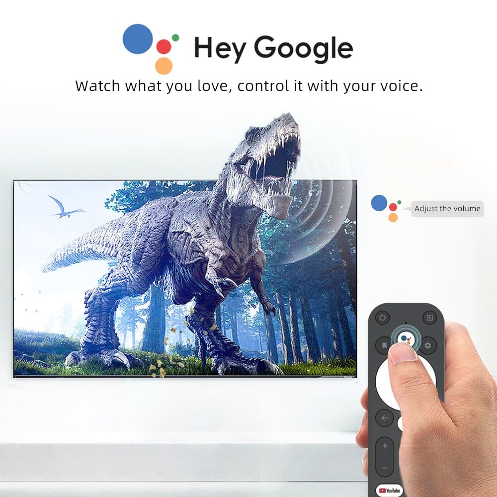 Digital image promoting Google Assistant voice control for smart TV showing a roaring T-Rex on screen, a hand holding a Google TV remote, the "Hey Google" logo, and colorful Assistant dots indicating "Adjust the volume"
