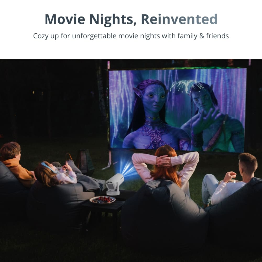 Photograph of friends relaxing on dark bean bag chairs watching the blue-skinned Na'vi from Avatar on an outdoor screen, powered by a white projector, with colorful berries on a nearby table