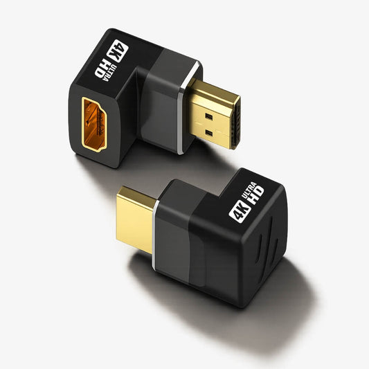 Product photograph of two black L-shaped HDMI adapters with gold-plated connectors and white ULTRA 4K HD text