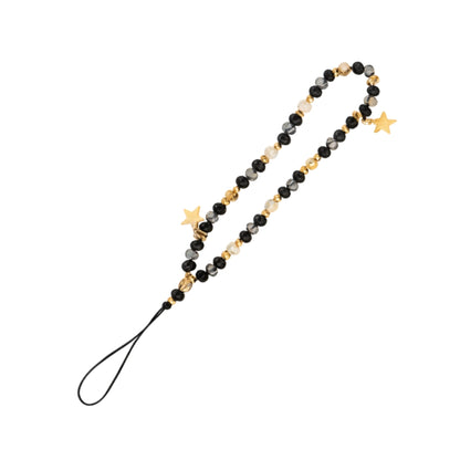 A shimmering beaded phone strap featuring a pattern of black, clear, and gold faceted beads with two metallic gold star charms and a black cord loop