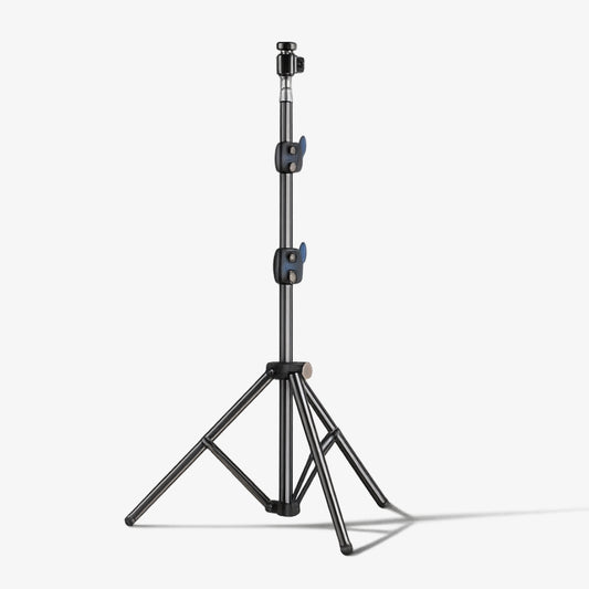 Product photography of a professional dark grey light stand featuring a telescopic center column, two vibrant blue quick-release adjustment levers, and a stable three-legged tripod base isolated on a clean white studio background