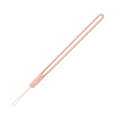 Product photo of a light pink silicone wrist strap featuring an elongated double loop and a thin string attachment against a clean white background