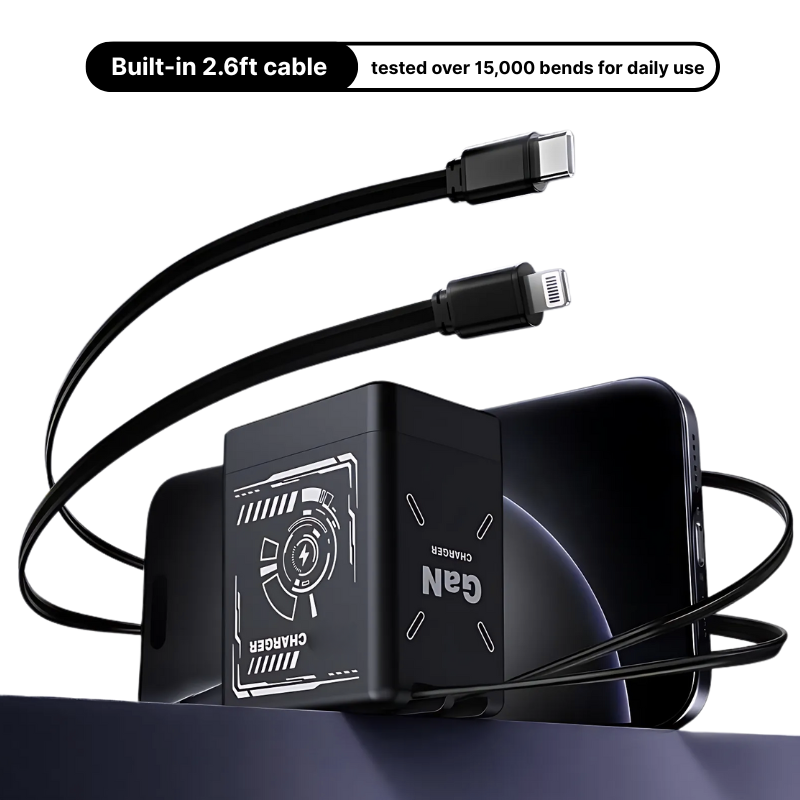 Black GaN charger with white circuit graphics and "GaN CHARGER" text, featuring integrated 2.6ft USB-C and Lightning cables, positioned on a dark blue surface next to a black smartphone