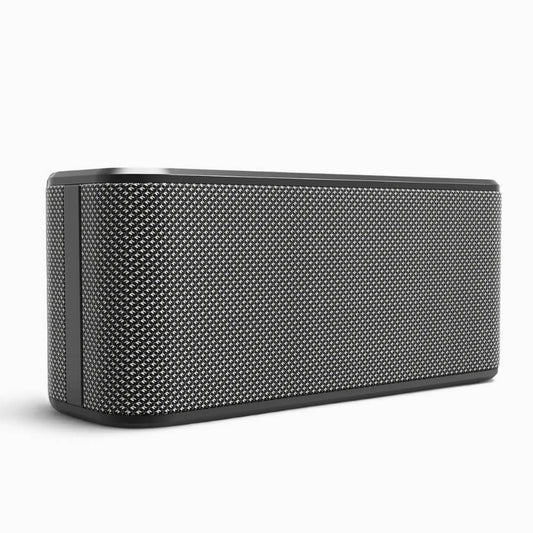 A dark gray rectangular portable speaker with rounded corners and a textured silver mesh grille on a white background