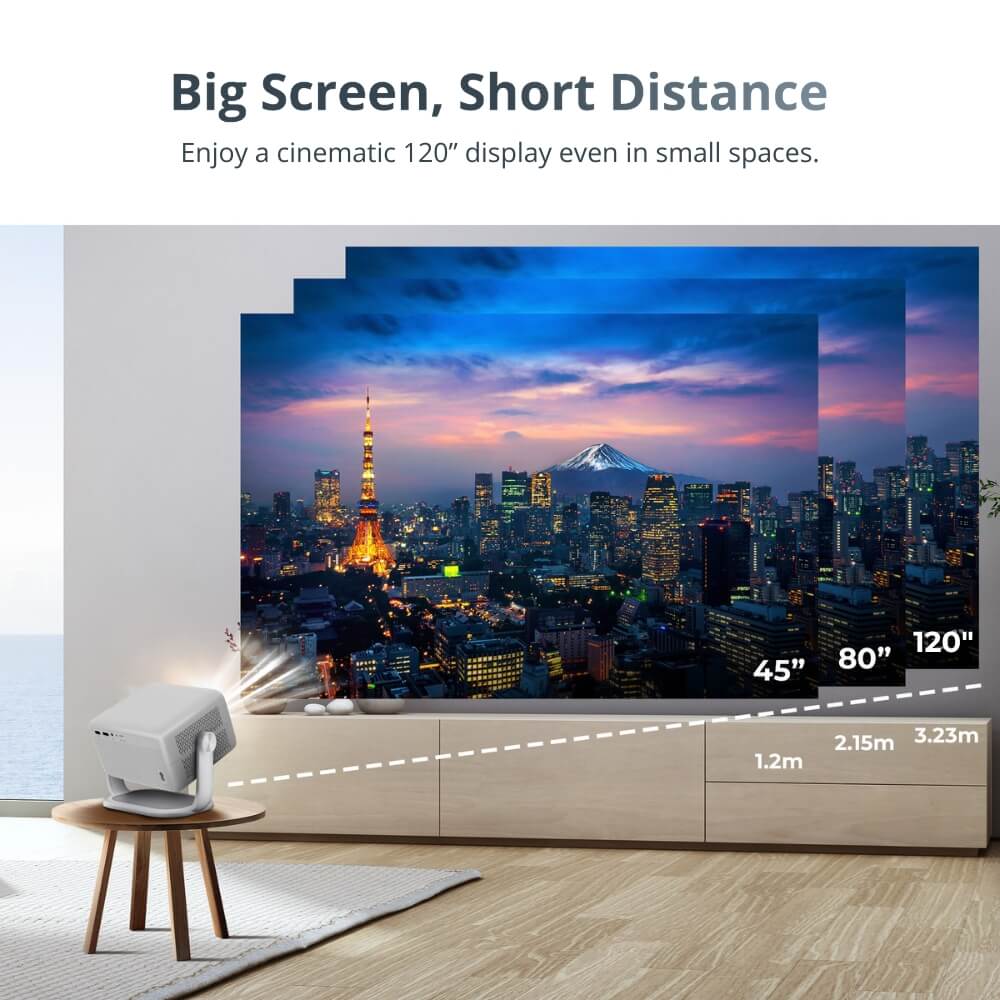 A white short-throw projector casts a large, vibrant 120-inch image of the Tokyo cityscape at twilight, featuring the glowing Tokyo Tower and distant snow-capped Mount Fuji, with diagrams illustrating screen sizes from 45 to 120 inches at short distances in a modern living room