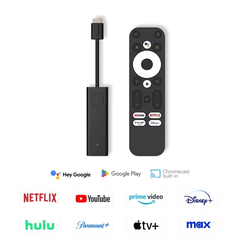 Digital product image of a black streaming media stick and matching remote with a prominent white directional pad and dedicated buttons for Netflix and YouTube, displayed on a white background alongside various colorful streaming service logos including Google Play, Chromecast built-in, Hulu, and Max