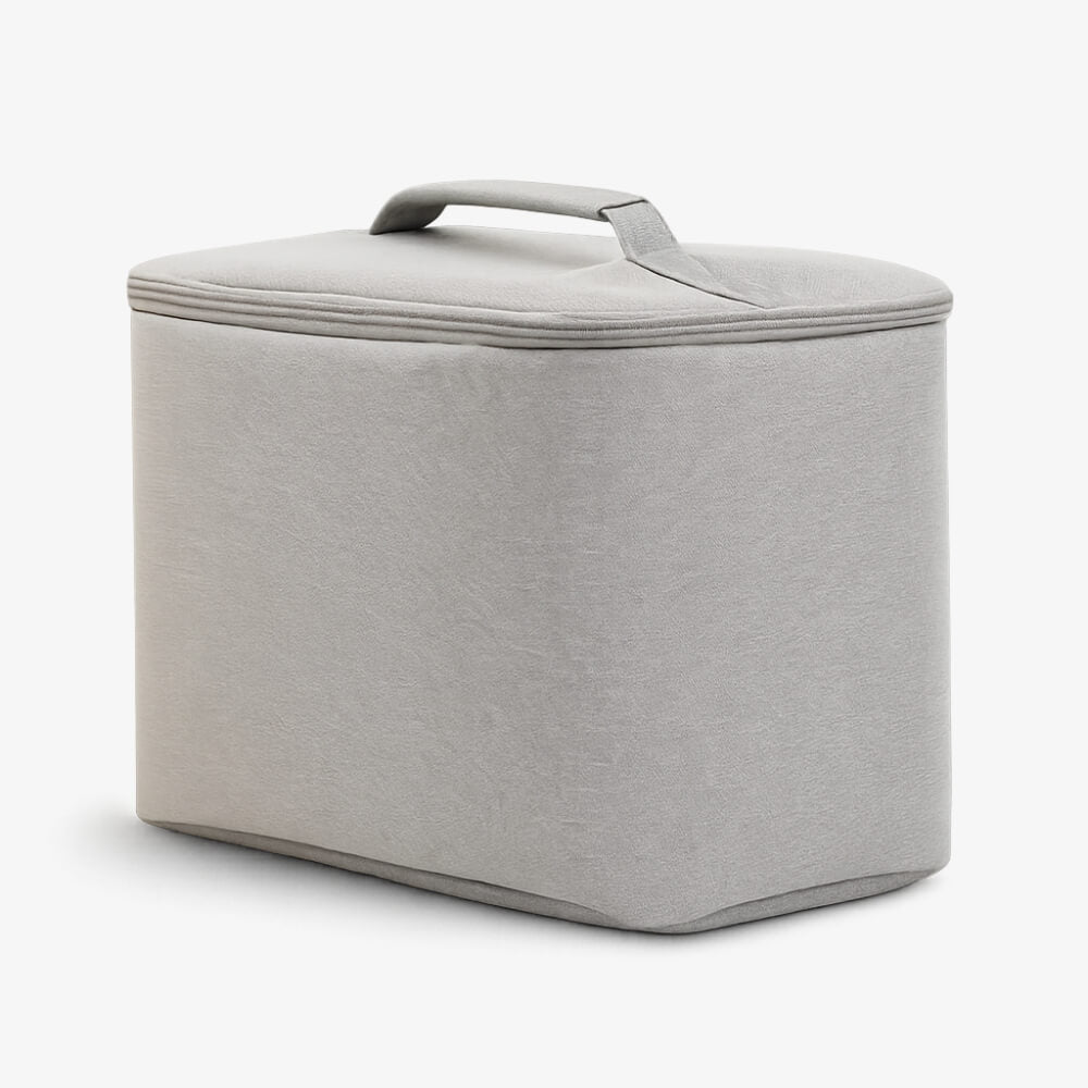 Light grey fabric storage box with rounded corners and a soft handle on the rectangular lid